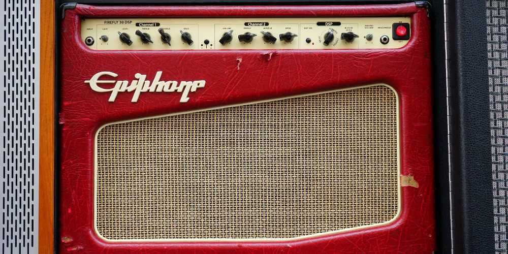 How can I stop my guitar amp from picking up the radio