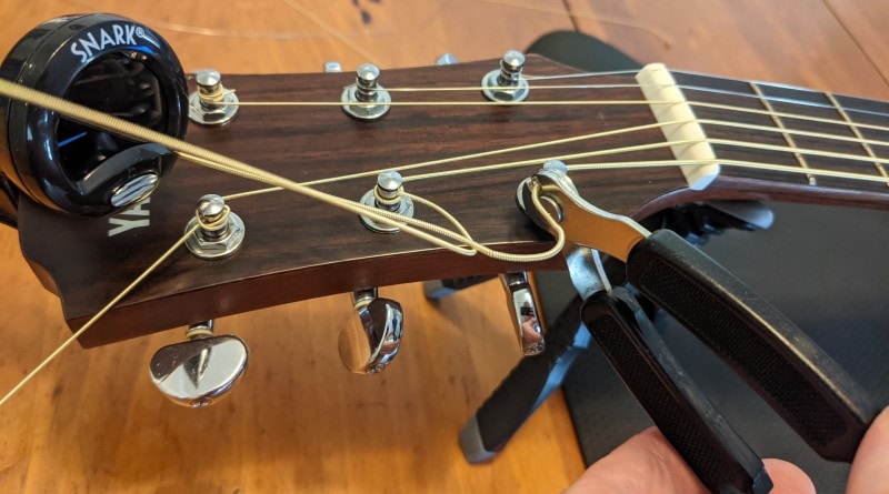How to Restring an Acoustic Guitar - cut off slack