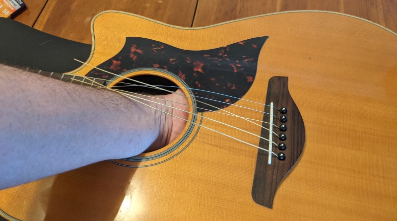 How to Restring an Acoustic Guitar - remove bridge pins from the back