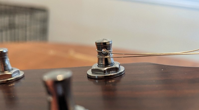 How to Restring an Acoustic Guitar - secure strings on posts